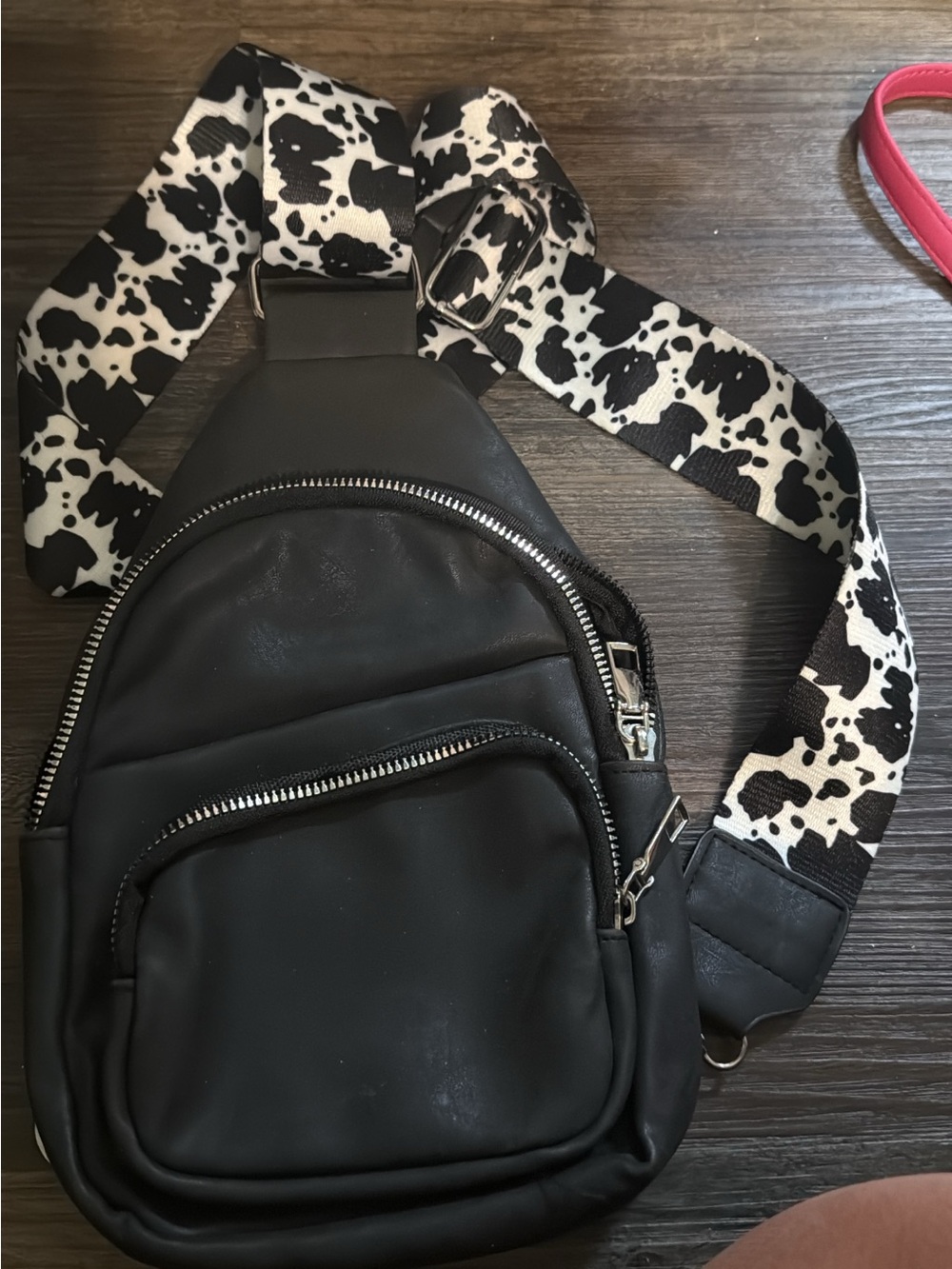 Black Crossbody Sling Bag with Black & White Cow Print Strap